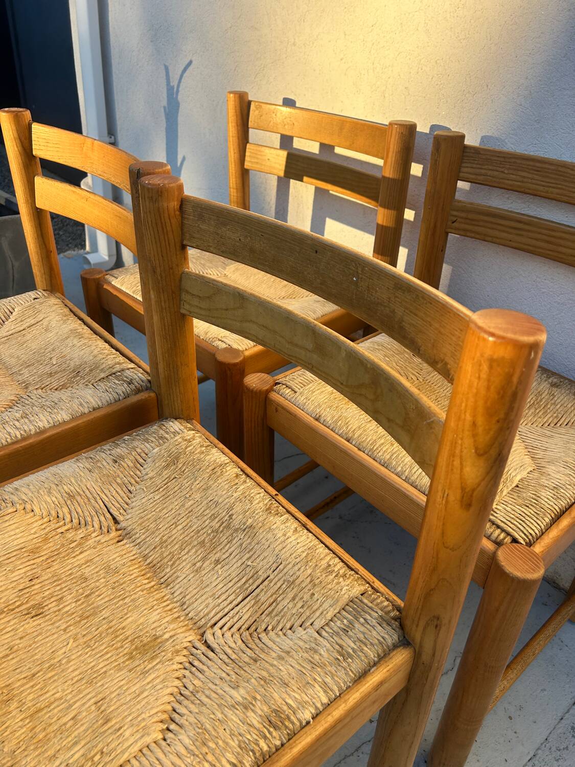 4 vintage chairs made of solid wood and woven straw
