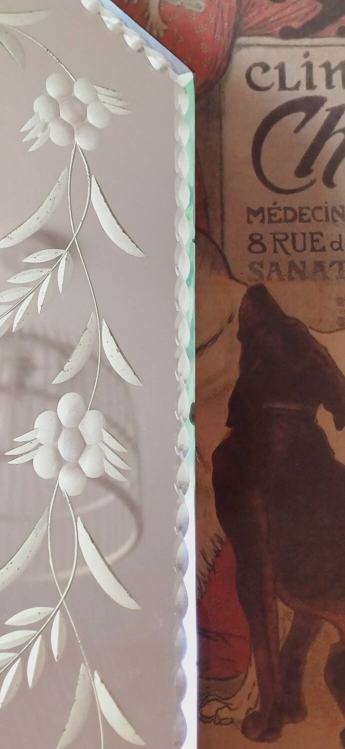 Beveled mirror with floral decor