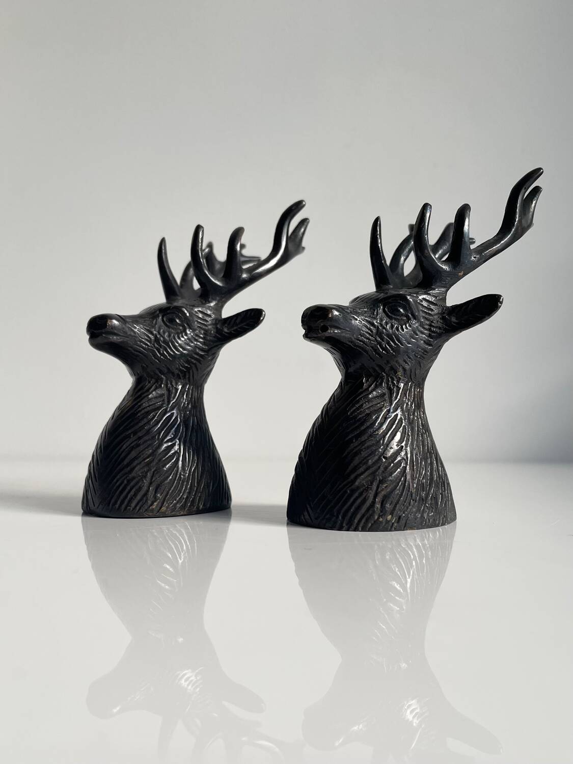 Salt and pepper shaker set with patinated brass deer heads.