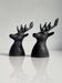 Salt and pepper shaker set with patinated brass deer heads.