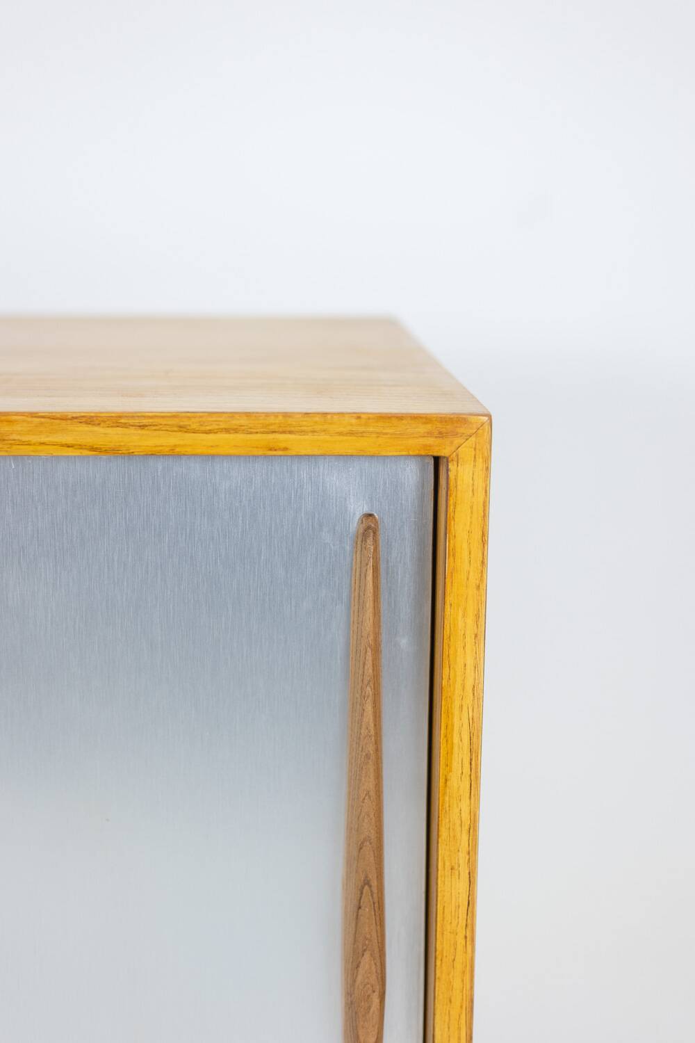 Low ash sideboard with sliding doors. 1960s.