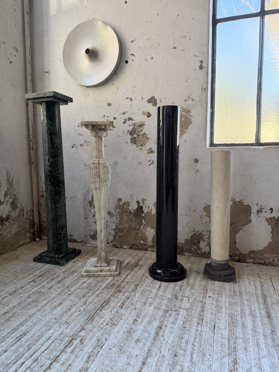 Set of 4 marble columns or pedestals.