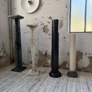 Set of 4 marble columns or pedestals.