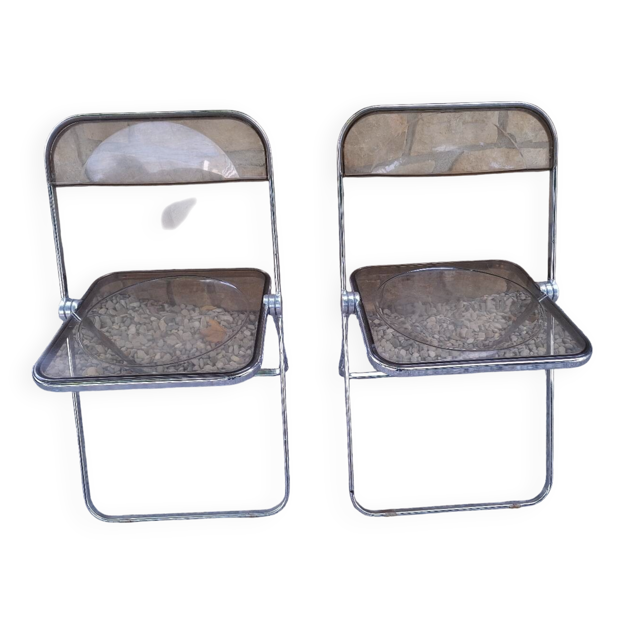 2 folding chairs designed by Giancarlo Piretti for Castelli