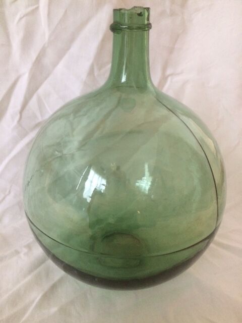 Demijohn old transparent green, estimated capacity around 12 to 15L