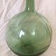 Demijohn old transparent green, estimated capacity around 12 to 15L