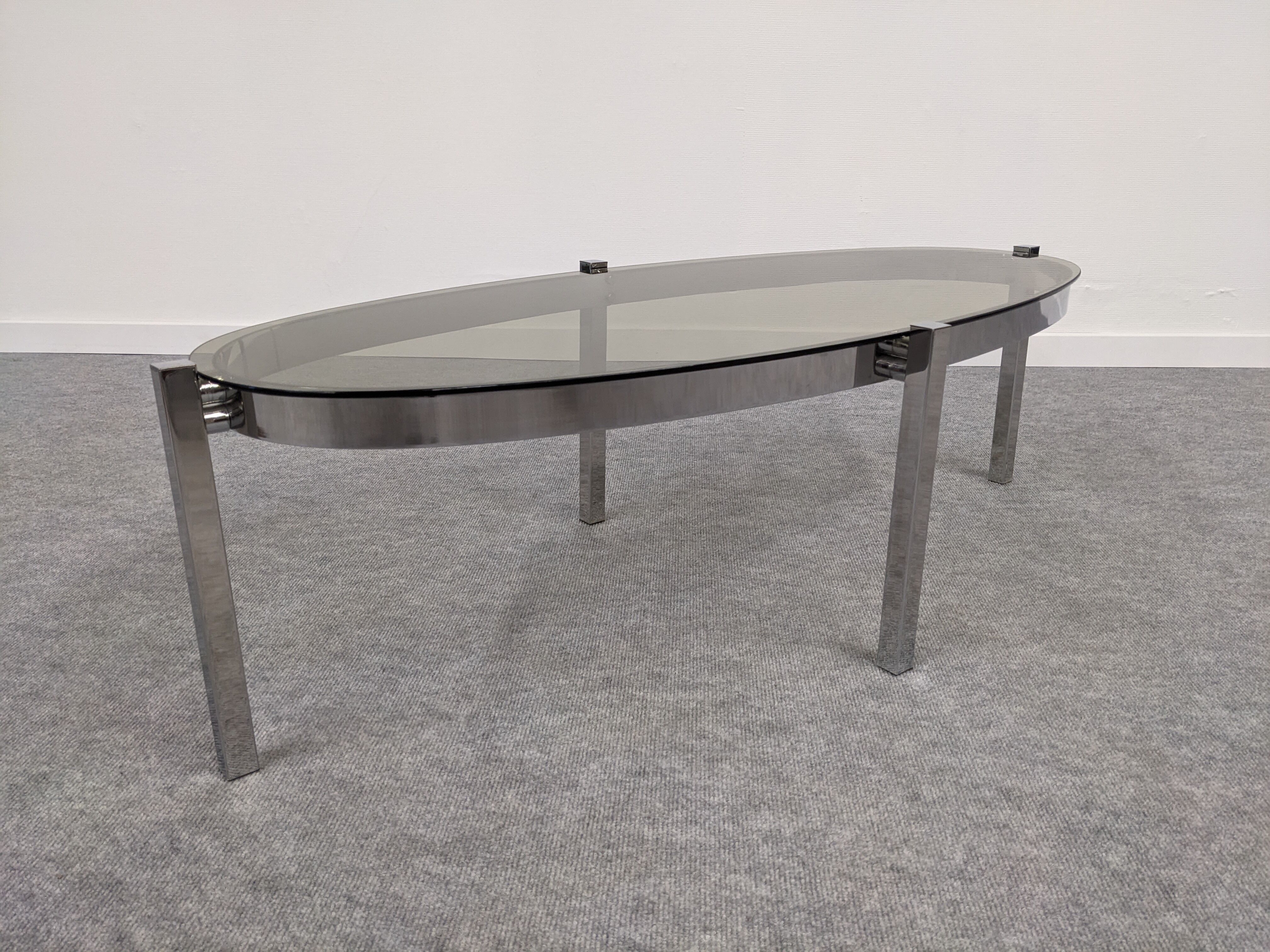 Oval smoked glass coffee table from the 60s/70s