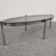 Oval smoked glass coffee table from the 60s/70s