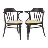 Paire de fauteuils en bois cintré, en hêtre noir et sièges en osier de Vienne, années 1990.
