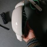 Empty green and white ceramic bird pocket