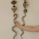 Pair of Neo-Egyptian Style Engraved Brass Wall Sconces Featuring Cobras