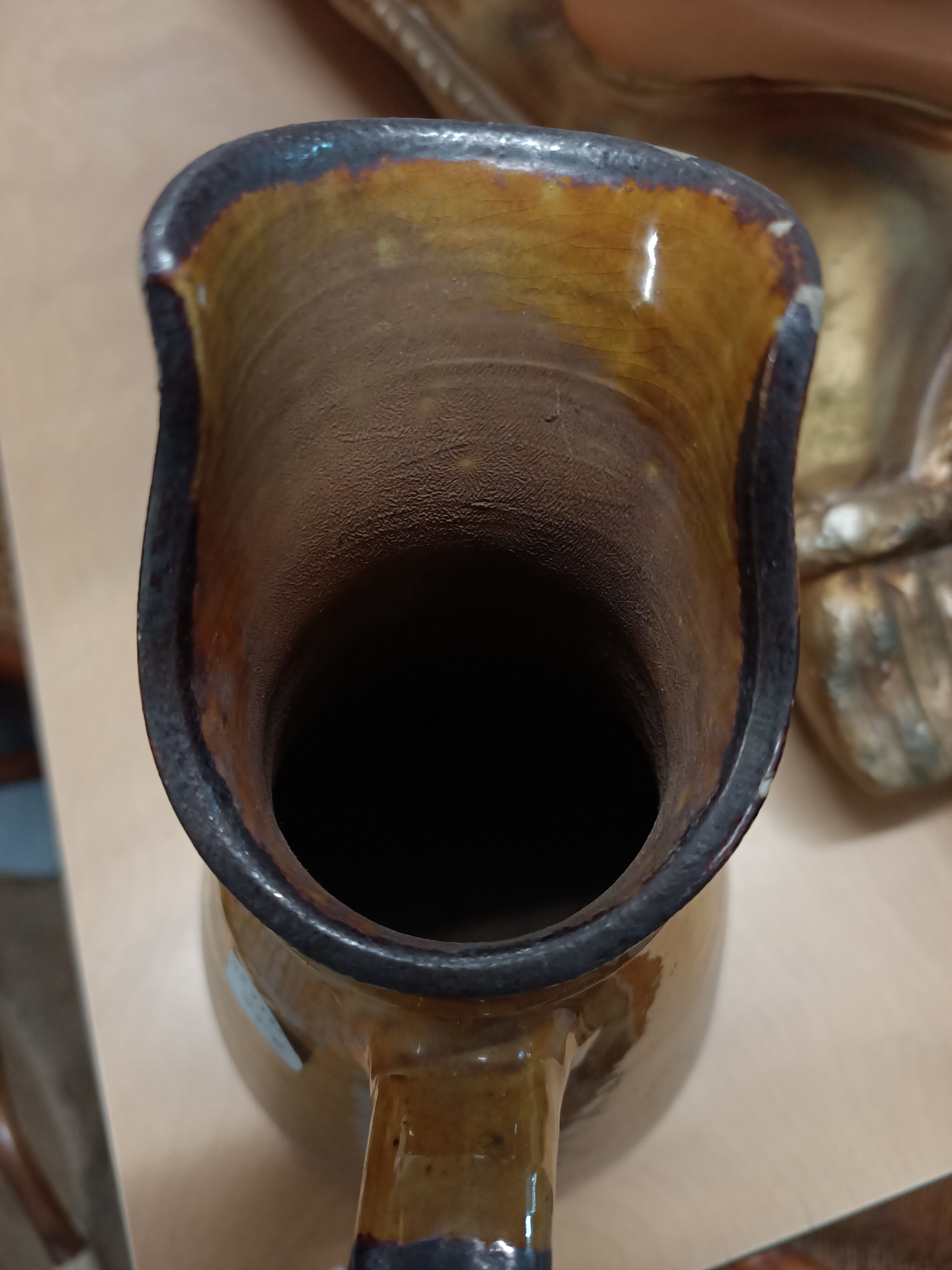 Enamelled terracotta jug