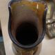 Enamelled terracotta jug