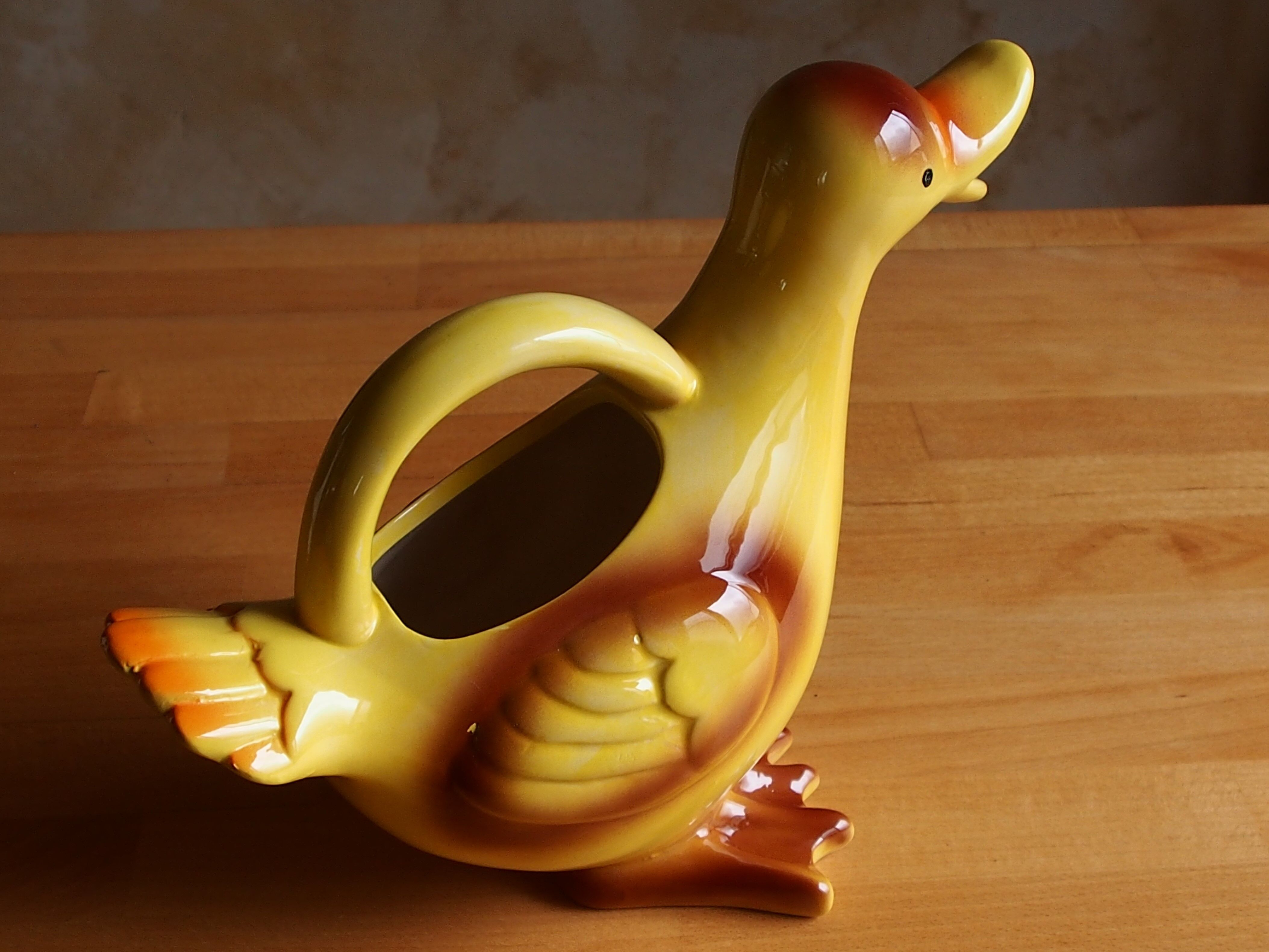 Ceramic watering can in white earthenware, yellow enamel and bird shape