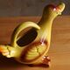 Ceramic watering can in white earthenware, yellow enamel and bird shape