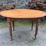 Table ovale ancienne en cerisier pieds parapluie