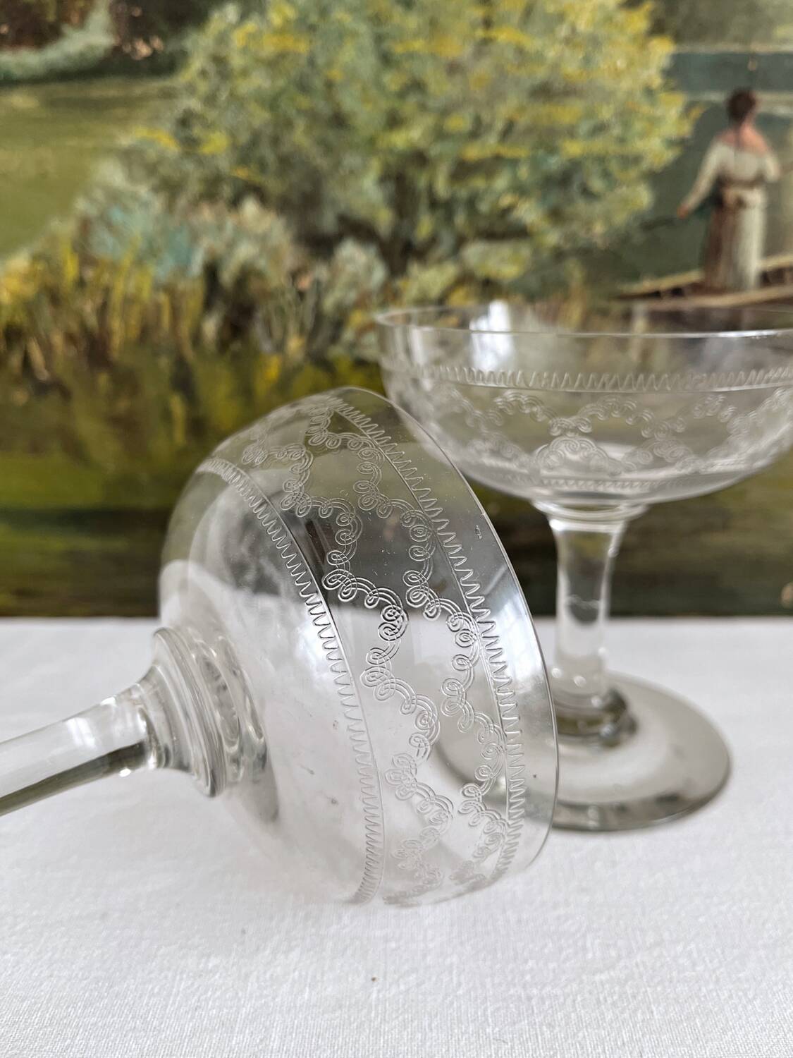 2 antique champagne glasses in engraved glass