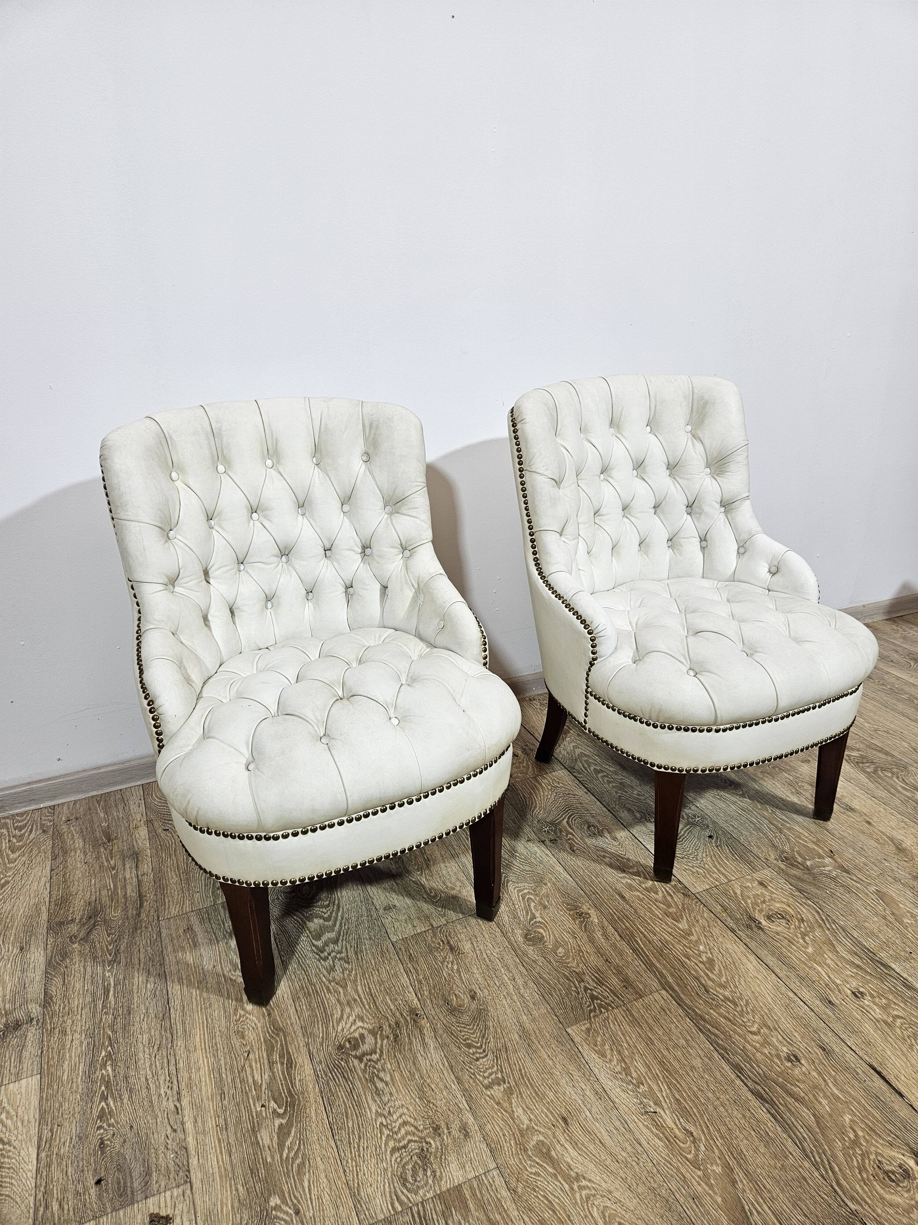 A pair of chesterfield armchairs, England, 1960s