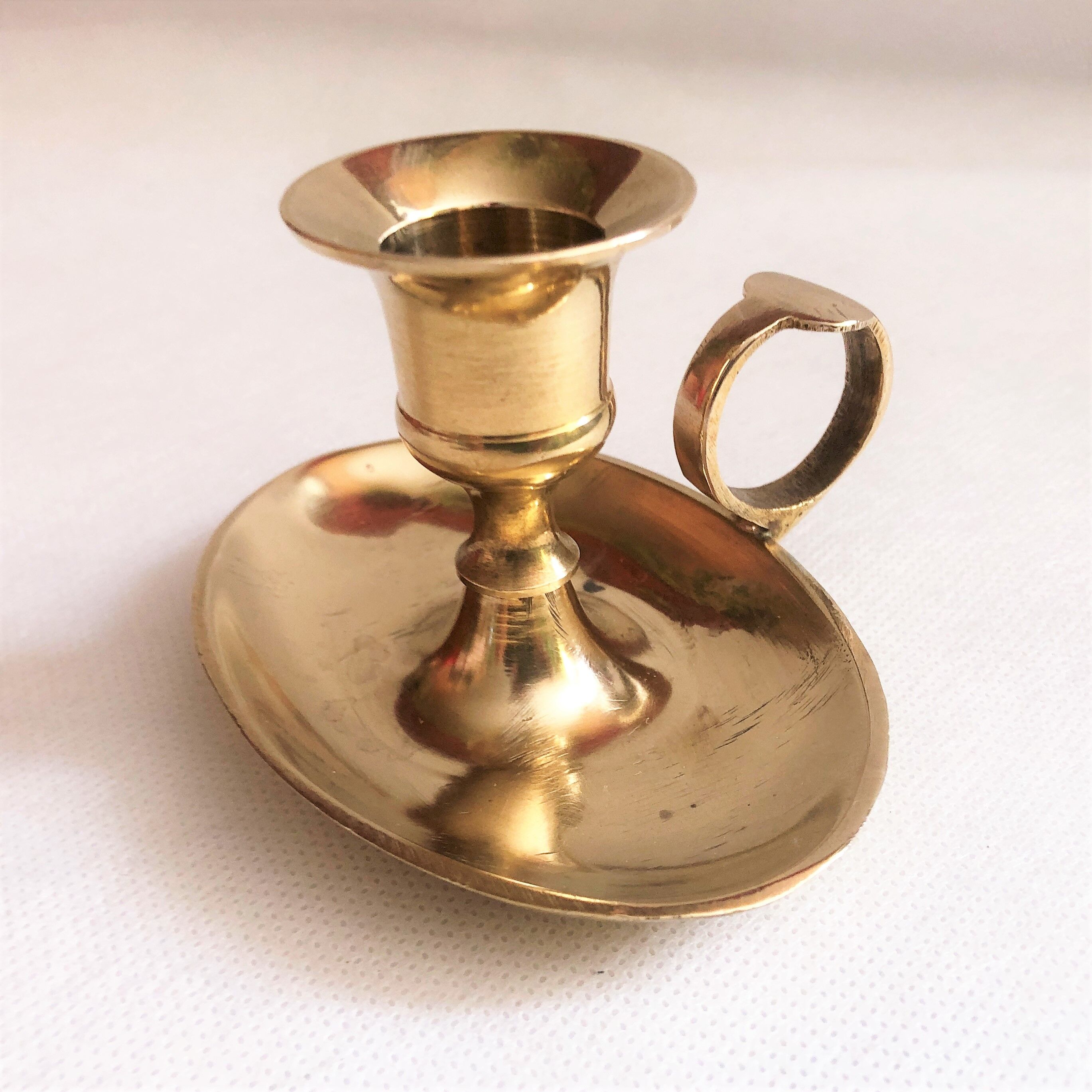 Brass oval hand candle holder