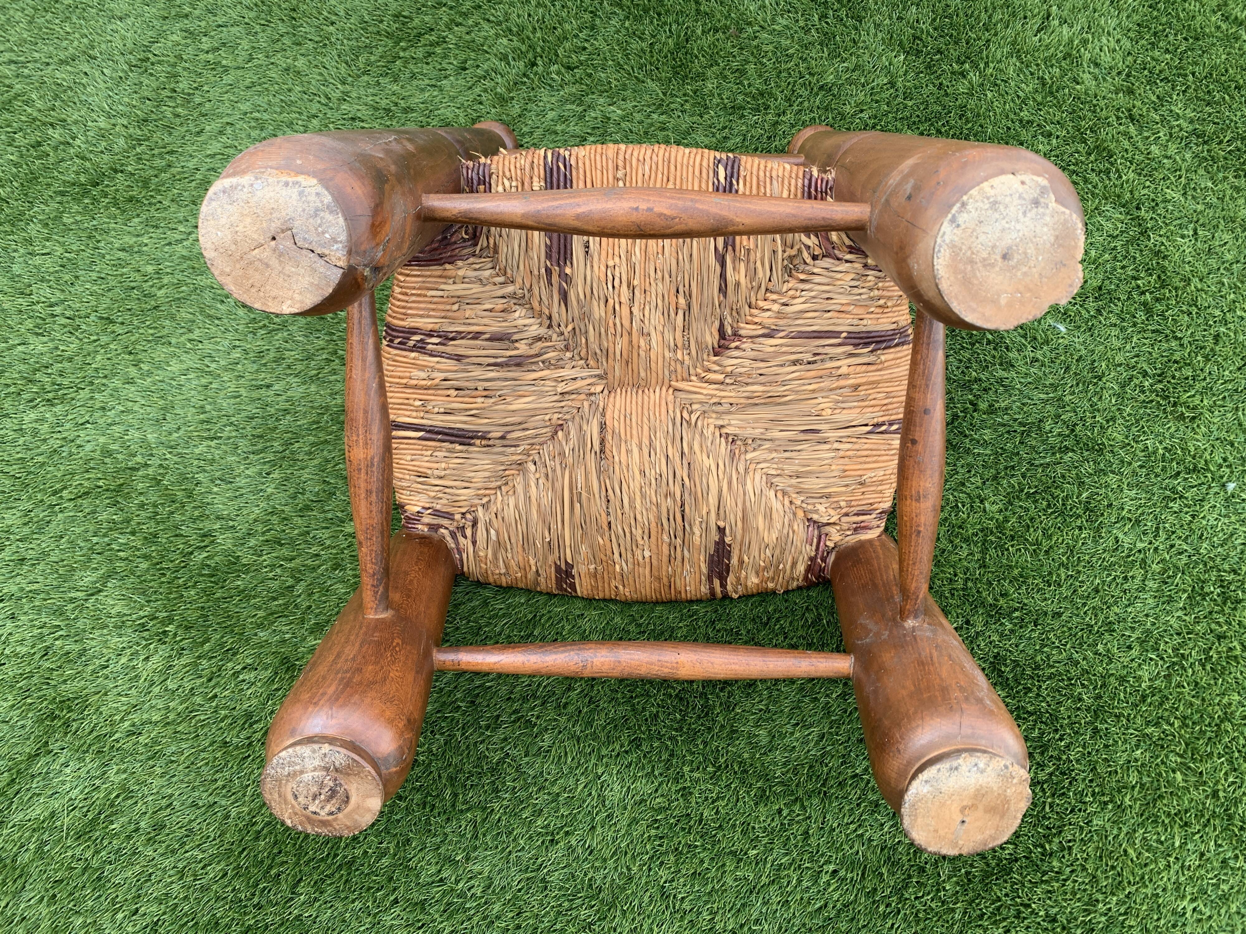 Pair of antique low fire chairs made of wood and straw