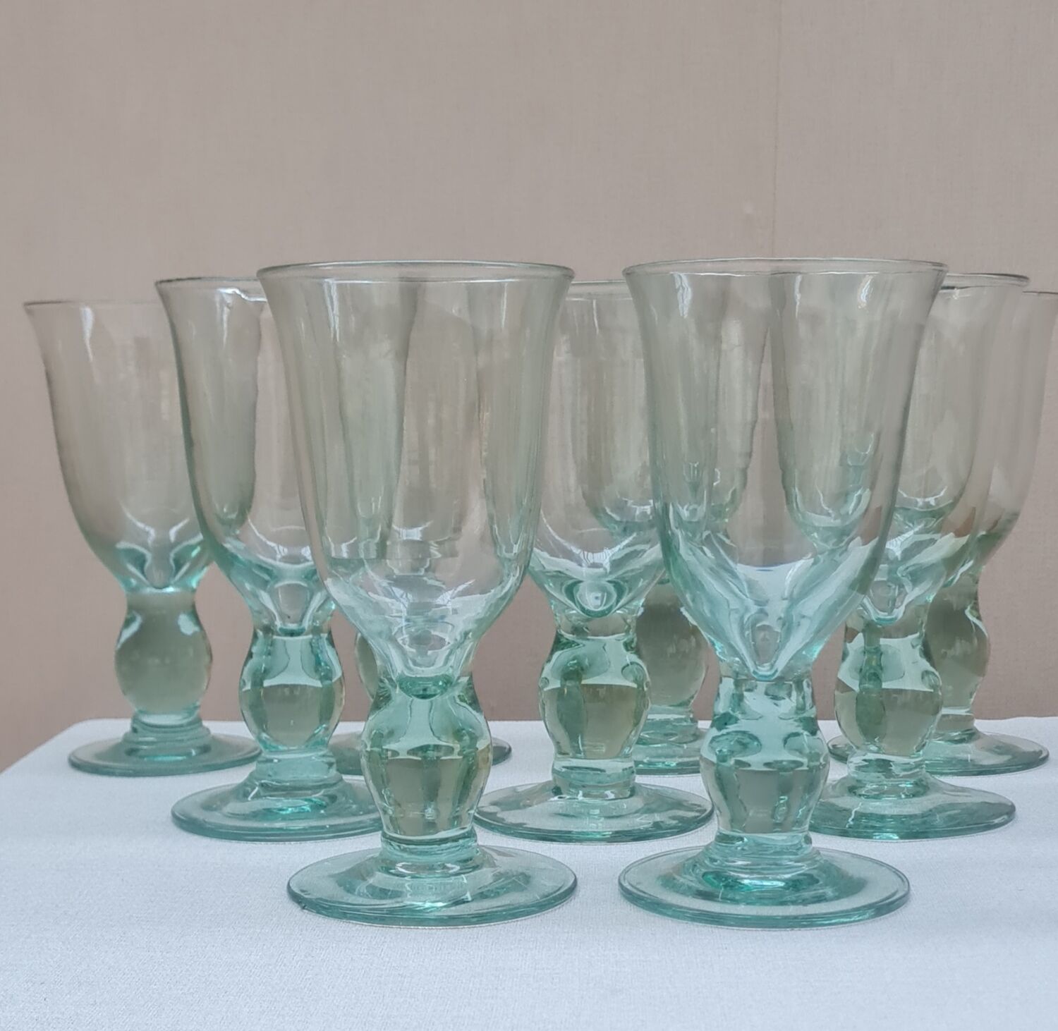 Service of 9 large blown glass stemmed glasses