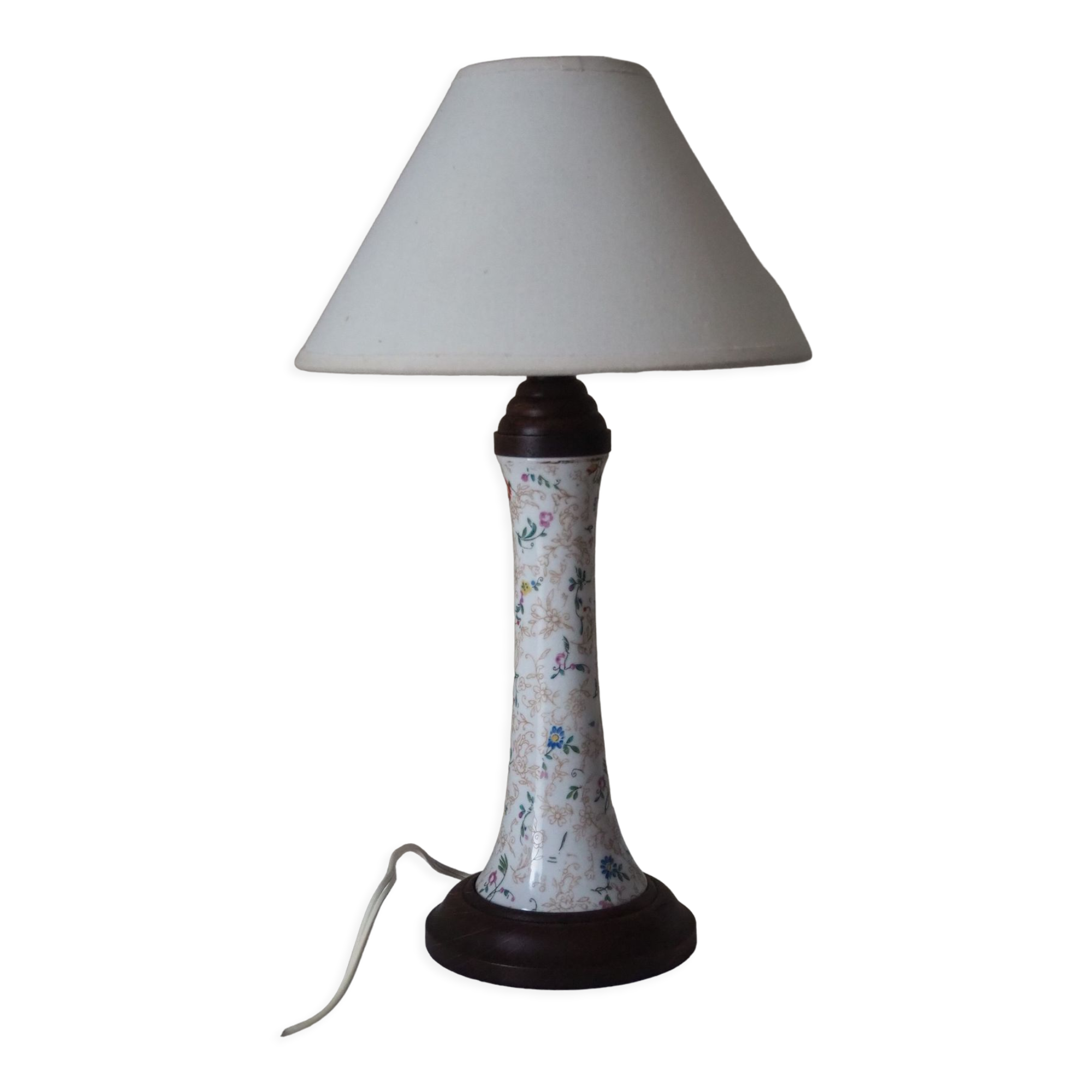 Table lamp for bedside use in earthenware with a wooden base.