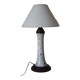 Table lamp for bedside use in earthenware with a wooden base.