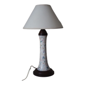 Table lamp for bedside use in earthenware with a wooden base.