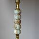 Lamppost in veined onyx and brass metal of the 1960s