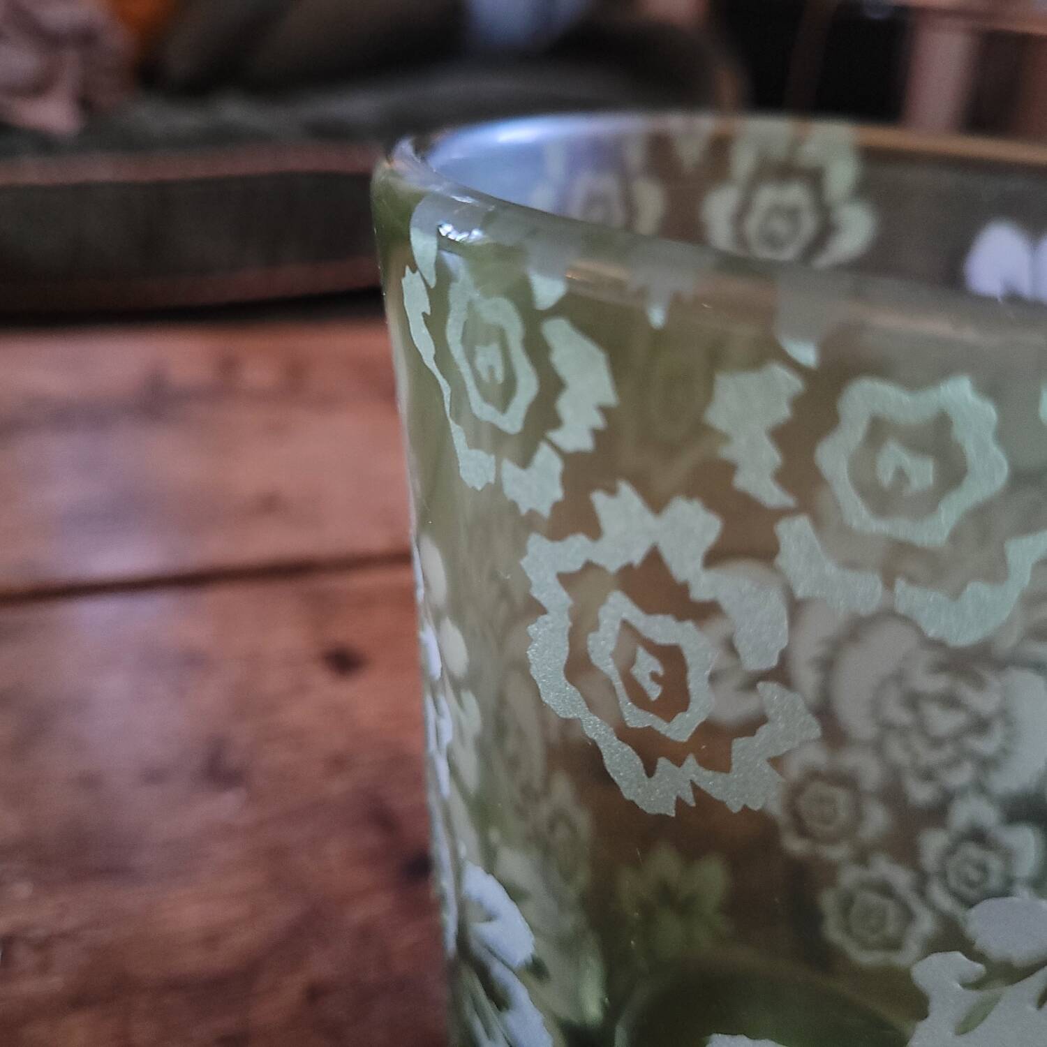 Green gradient blown glass vase with engraved floral decoration.