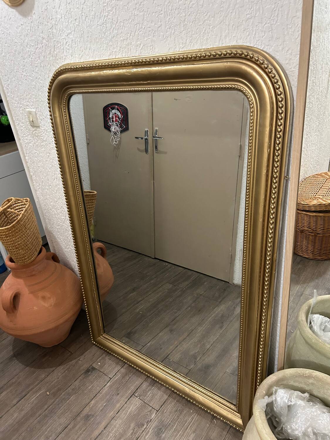 Antique gilded mirror in old Louis Philippe wood