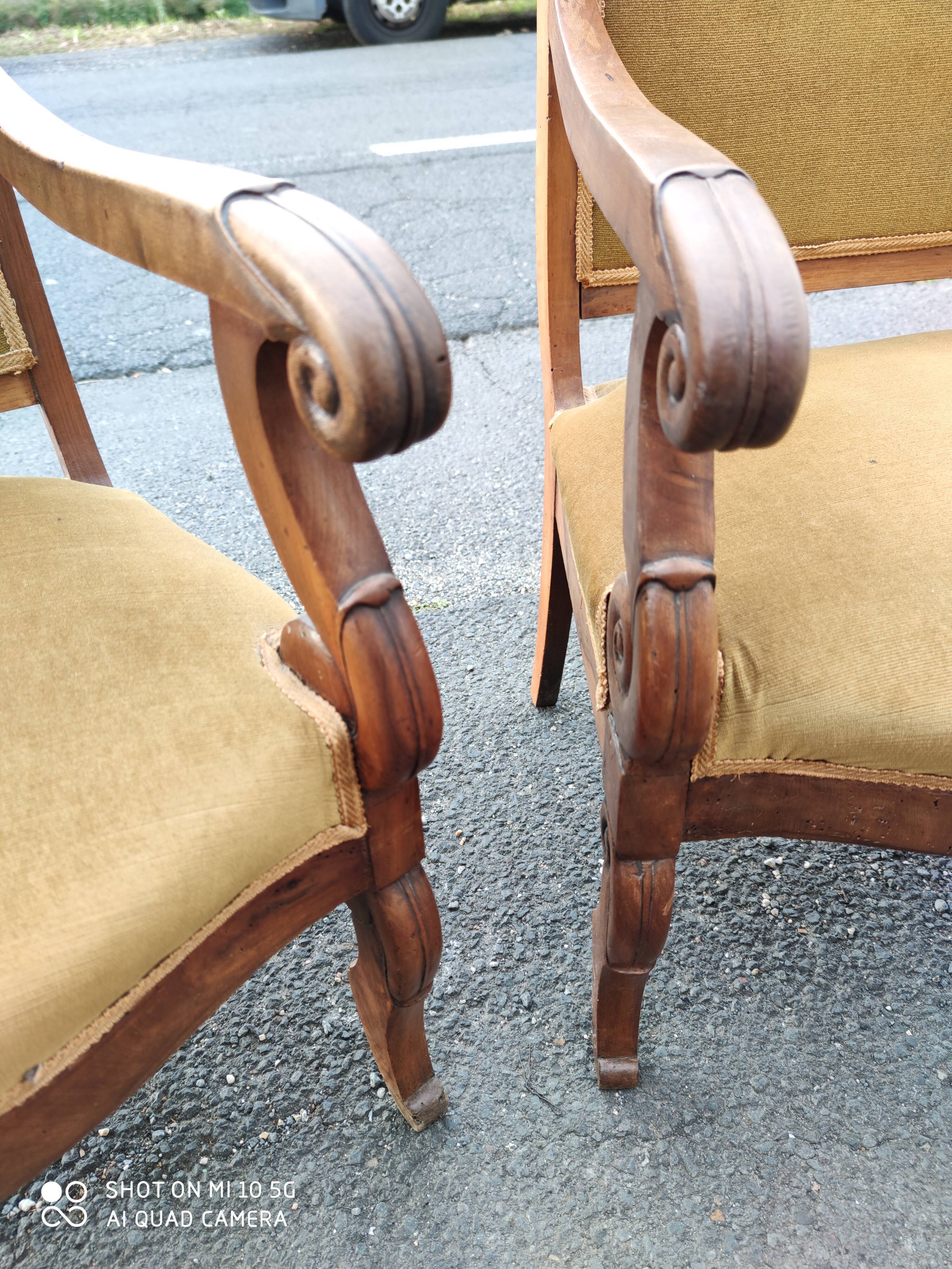 Pair of walnut armchairs from the Consulate period