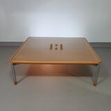 Rare coffee table 110 x 110 x height 35 cm with 8 flange wooden / cork caps in the glass top.