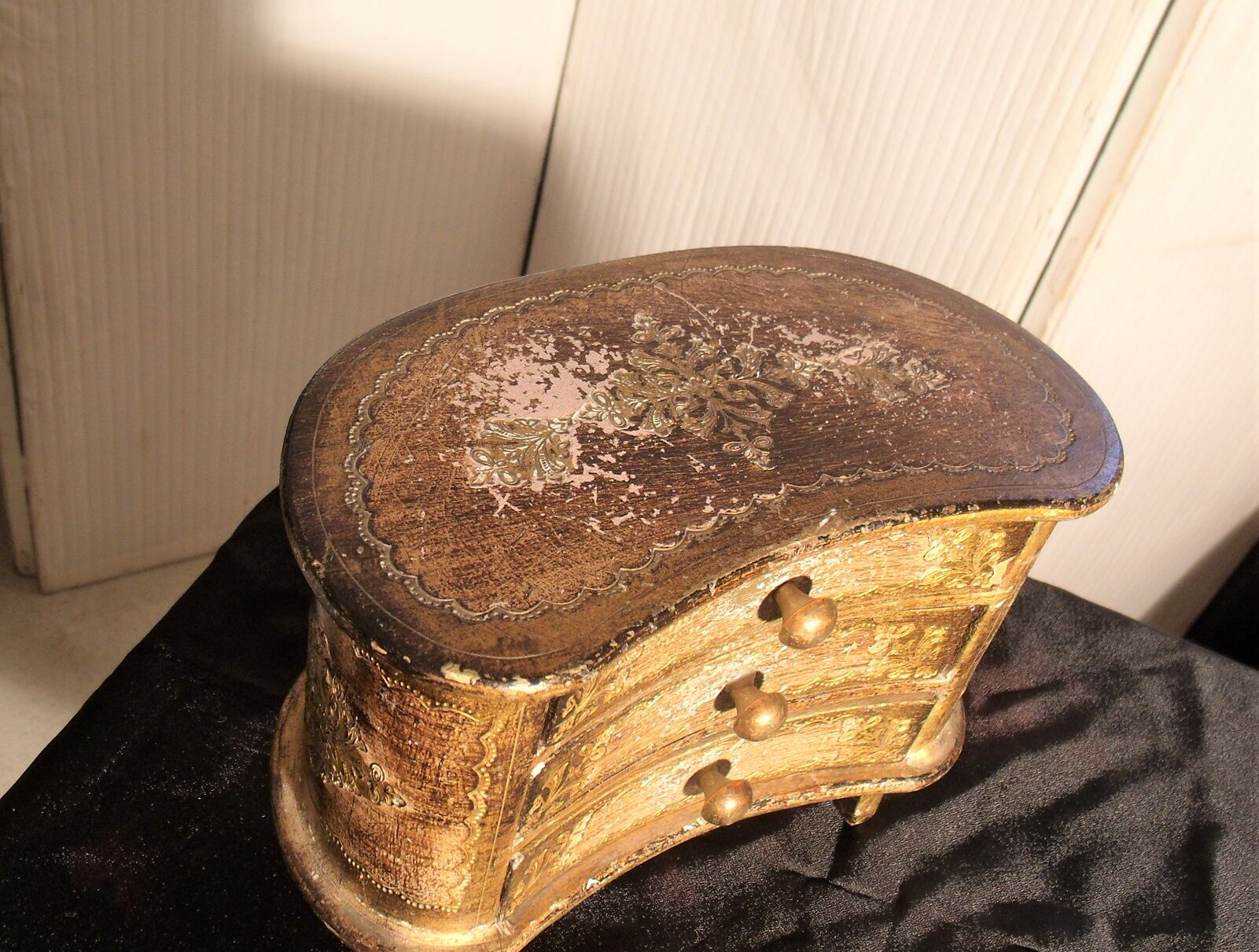 Jewelry box with gilded wooden drawers