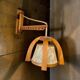 Vintage wooden wall lamp with rope detail.