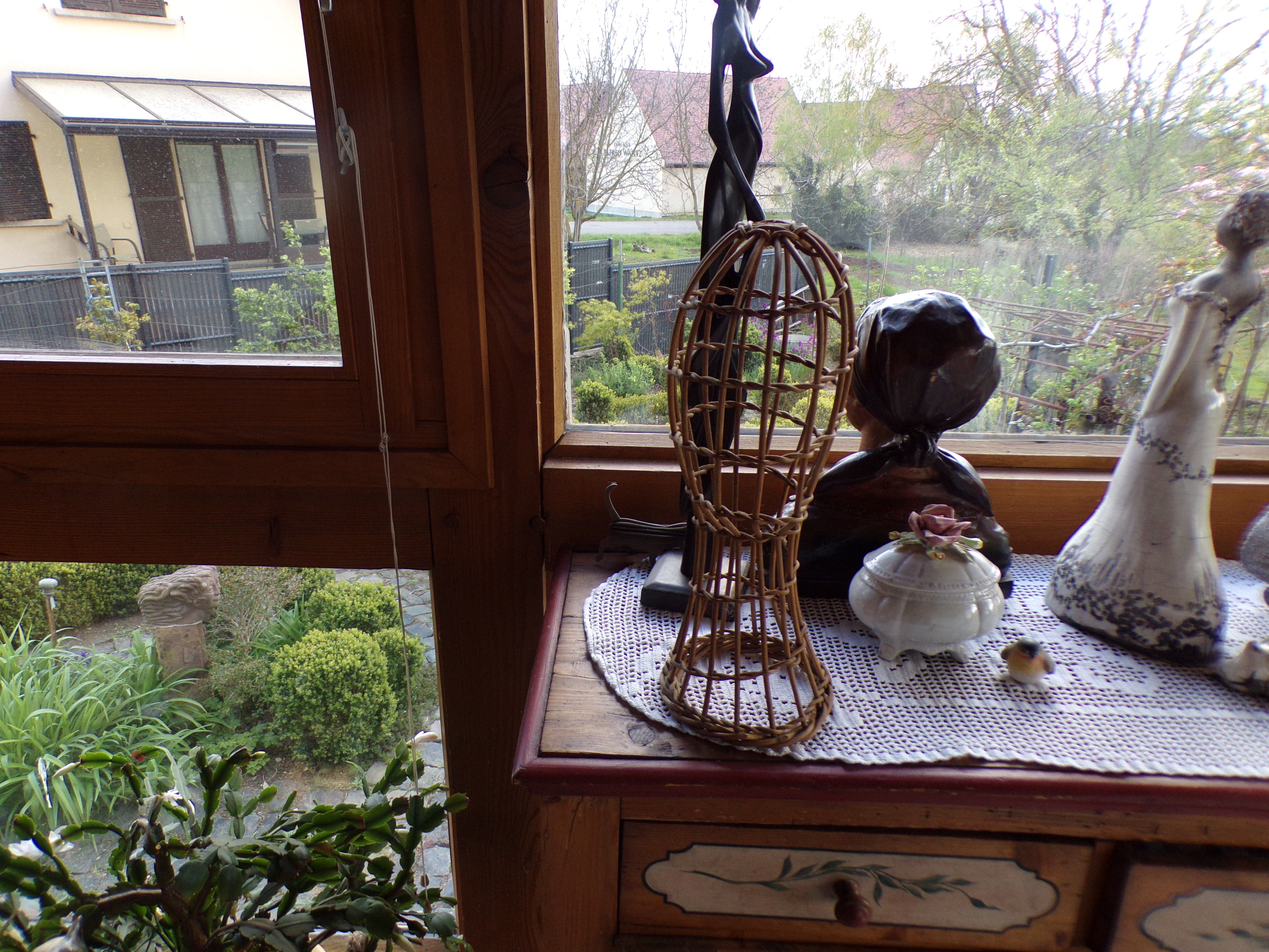 Old bust head in wicker