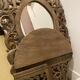 Carved mirror with integrated shelf