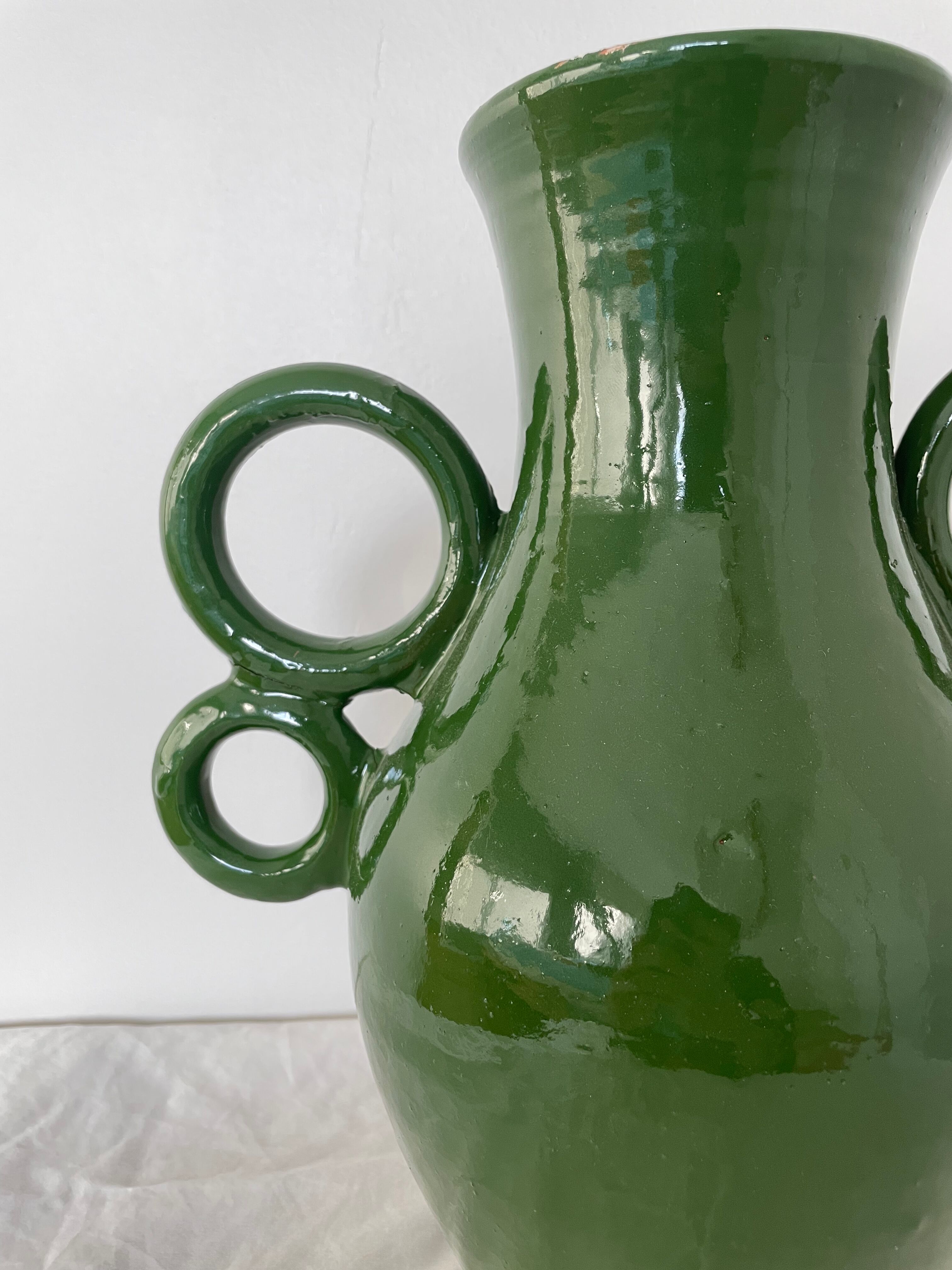 Green ceramic amphora vase with large handmade circular handles