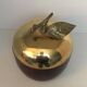 Apple-shaped ice bucket in red celluloid, gold-tone metal and plastic