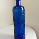 cobalt blue molded glass bottle in relief decoration bunches of grapes