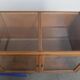 Large vintage wooden counter / display cabinet with 4 doors and glass