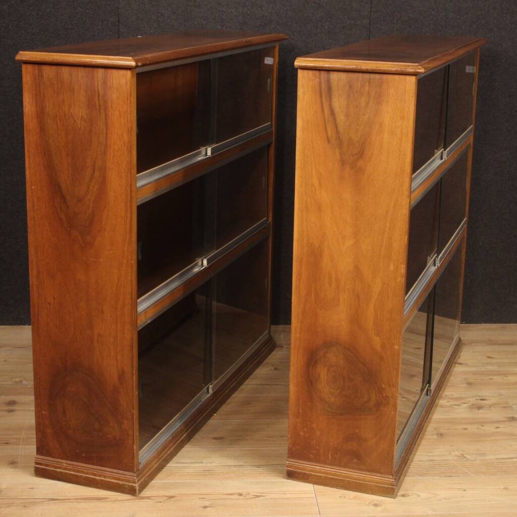 Pair of Italian bookcases in walnut wood with glass doors