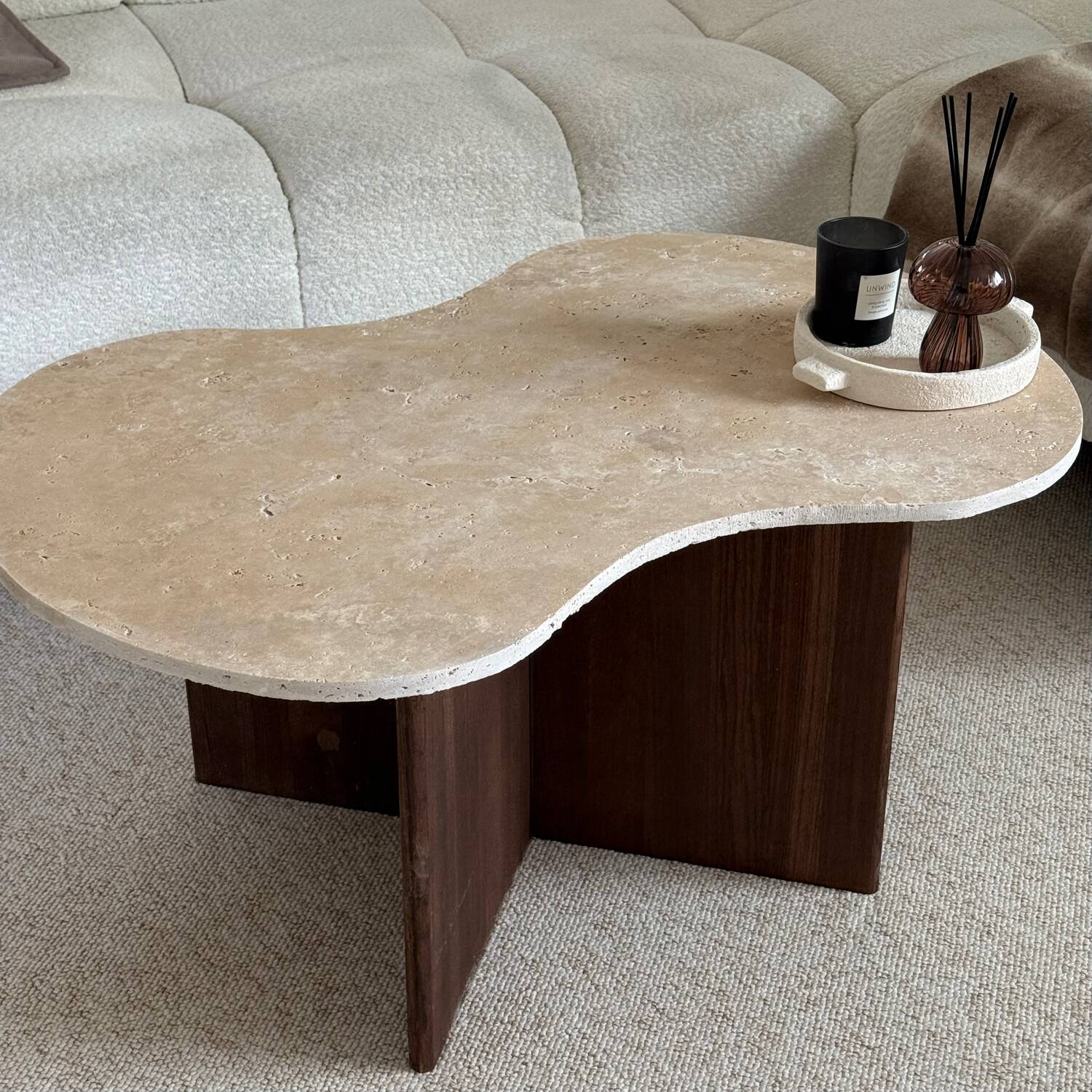 Cloud coffee table in travertine and dark oak.