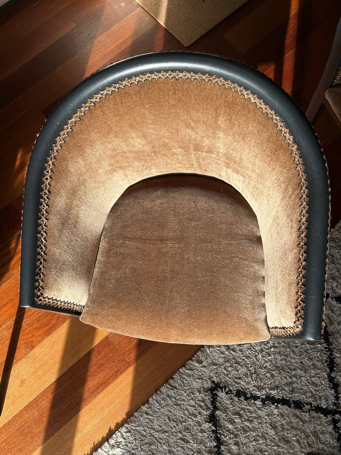 Pair of Art Deco barrel chairs in black and bronze