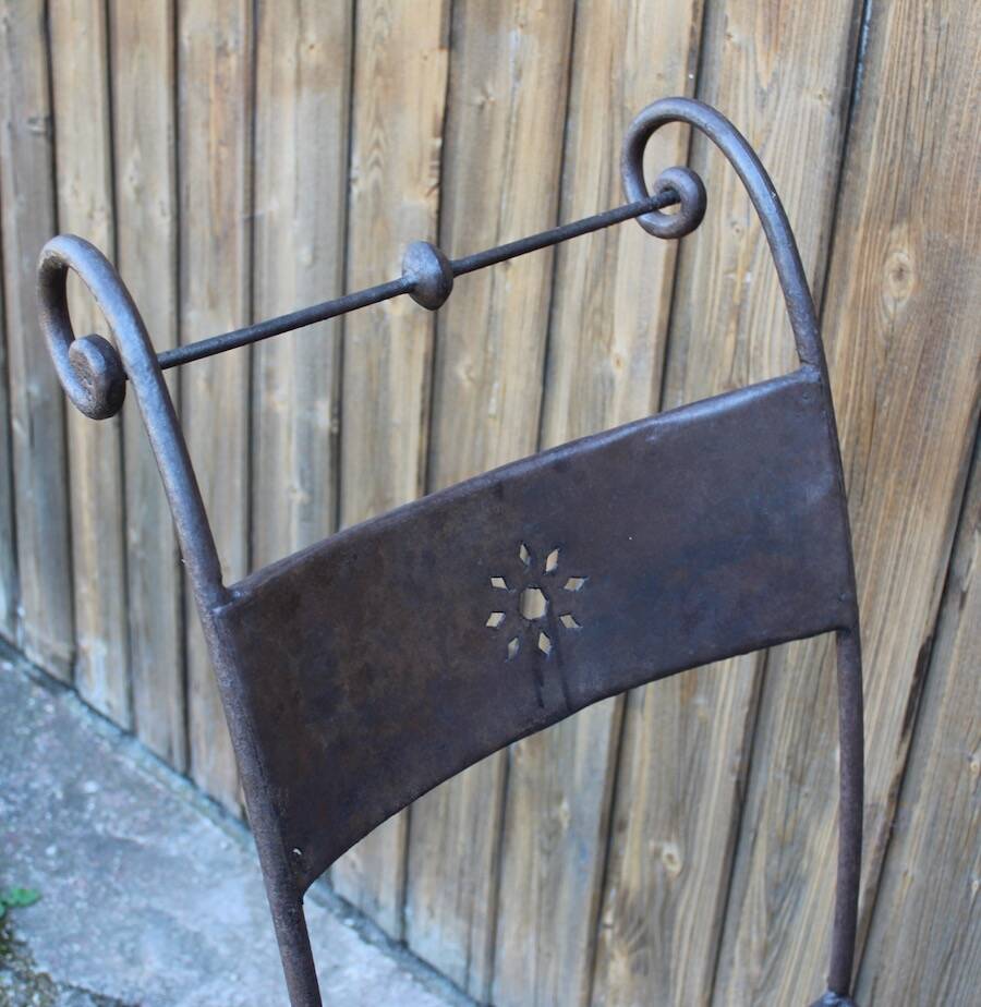 Series of 8 wrought iron garden chairs