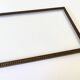 Wooden frame carved in beads, glazed, gray cardboard back and irzft paper