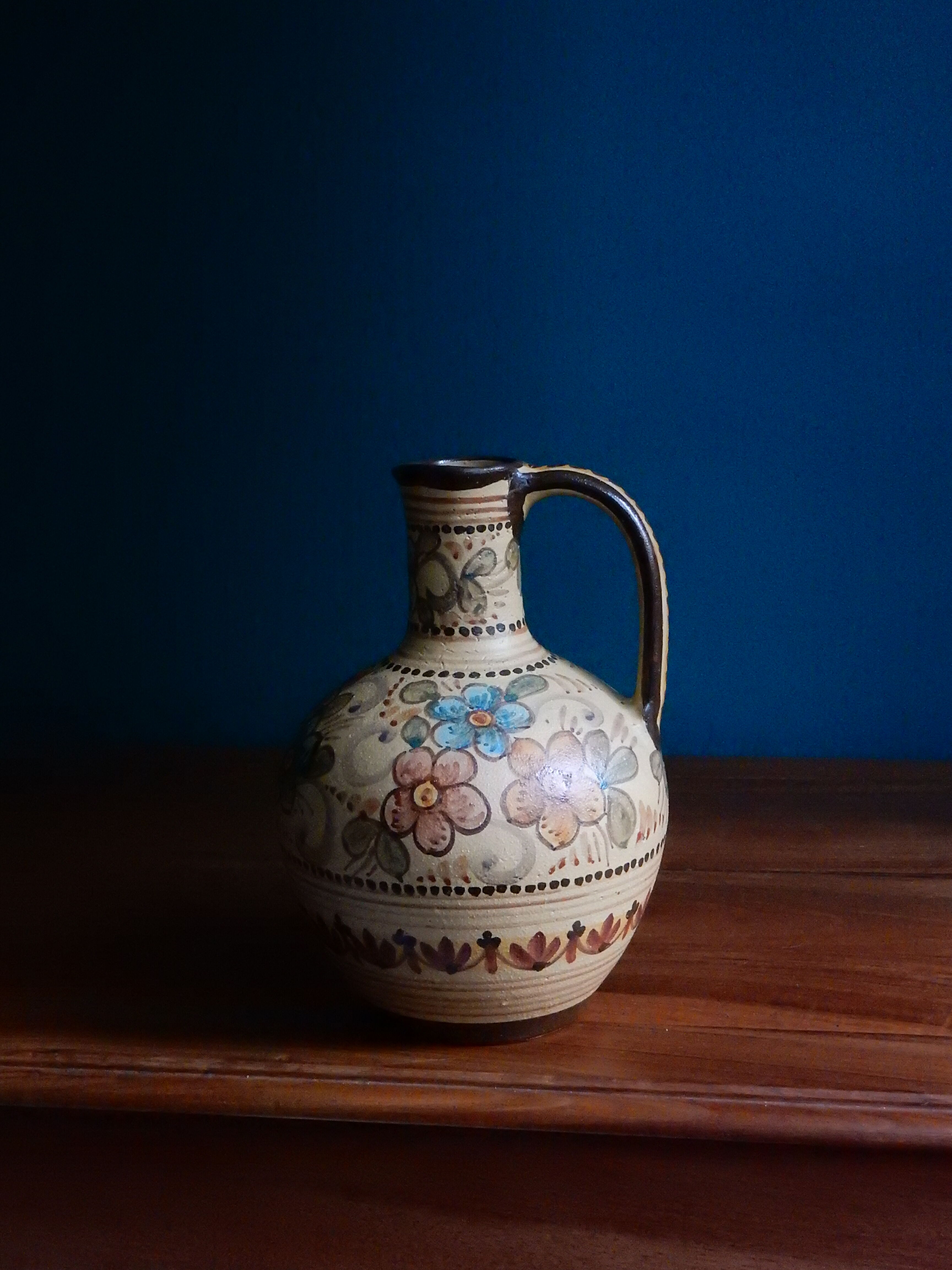 Hand-painted terracotta jug