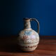 Hand-painted terracotta jug