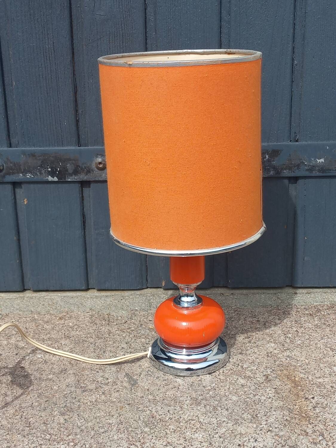Designer lamp from the 70s in chrome metal and orange lacquered wood
