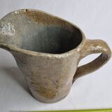 Handcrafted glazed stoneware pitcher decorated by hand